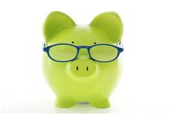Green piggy bank with glasses.