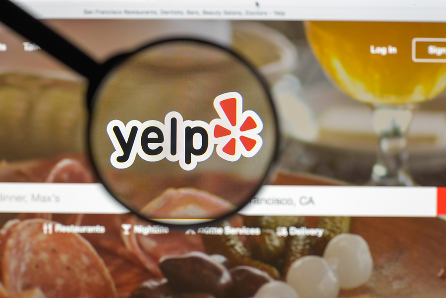 The Yelp Logo Under a Magnifying Glass