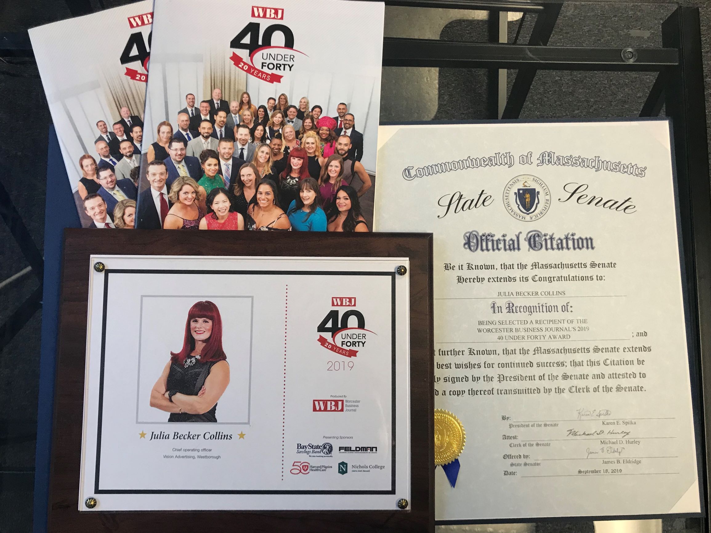 Collection of awards and collateral from 40 Under Forty program.