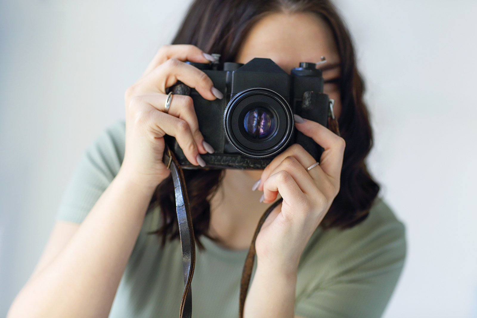 Young Brunette Woman Photographer Taking Photo With Camera