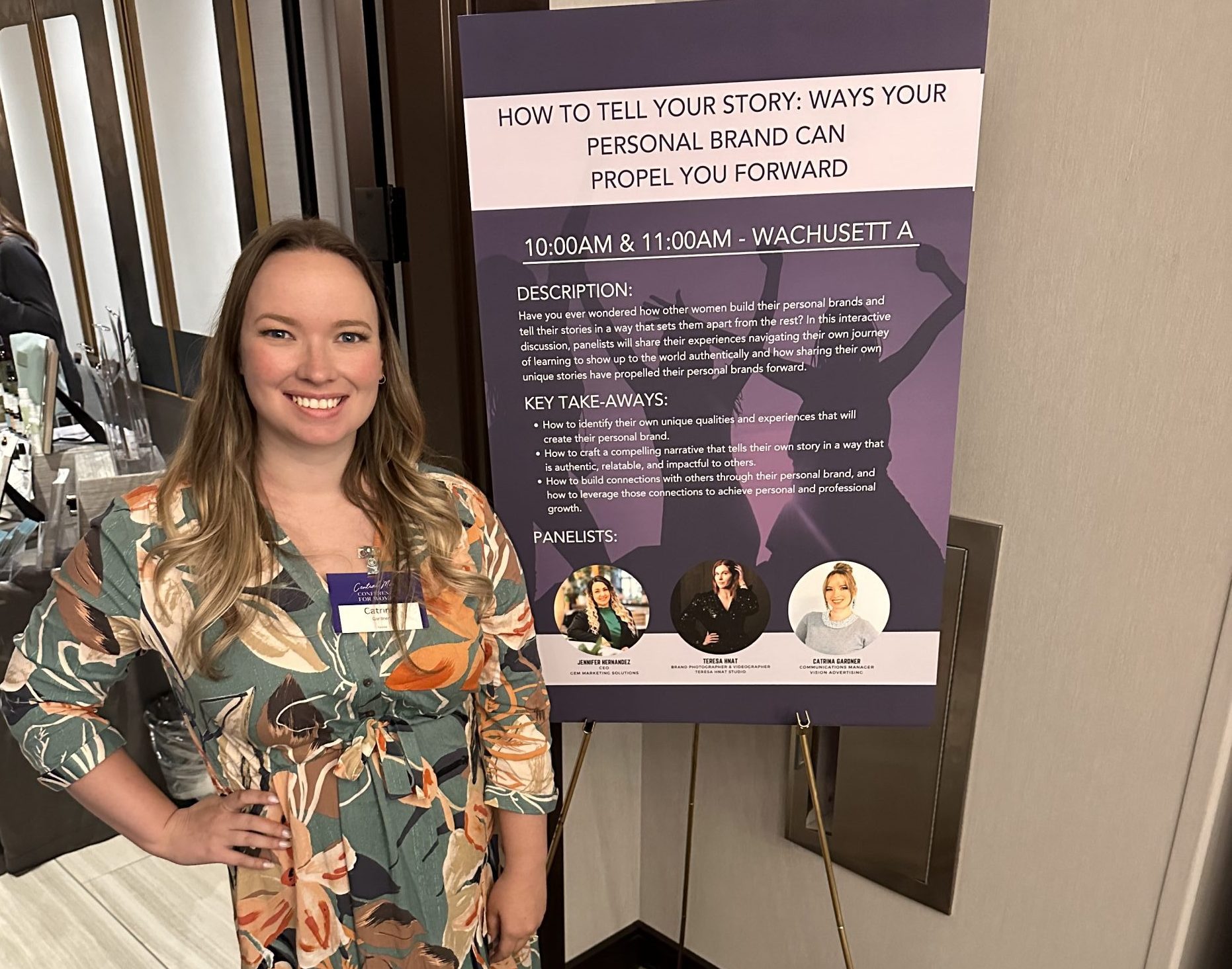 Vision's communications manager, Catrina Gardner, poses in front of a sign showing her panel information on personal brand at the She's Local Central Mass Conference for Women.